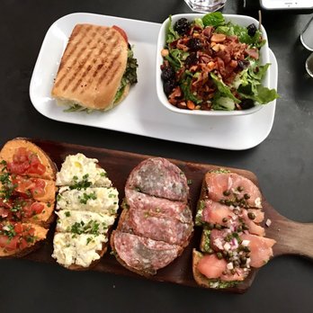 Postino Arcadia - Bruschetta ($15 - hummus and tomato, artichoke dip, salami pesto, salmon pesto) + turkey panini with Brussel sprouts salad ($11.50) - Wine Bars Near Me - Phoenix, Arizona Postino Arcadia - Bruschetta ($15 - hummus and tomato, artichoke dip, salami pesto, salmon pesto) + turkey panini with Brussel sprouts salad ($11.50) - Wine Bars Near Me - Phoenix, Arizona