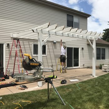 Barefoot Decks - a man working on a pergolated deck - General Contractors Near Me - Spring Grove, Illinois