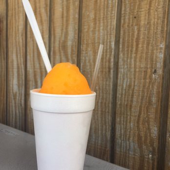 Bayou Snowballs - a white cup with a straw and a spoon - Shaved Snow Near Me - Gretna, Louisiana Bayou Snowballs - a white cup with a straw and a spoon - Shaved Snow Near Me - Gretna, Louisiana