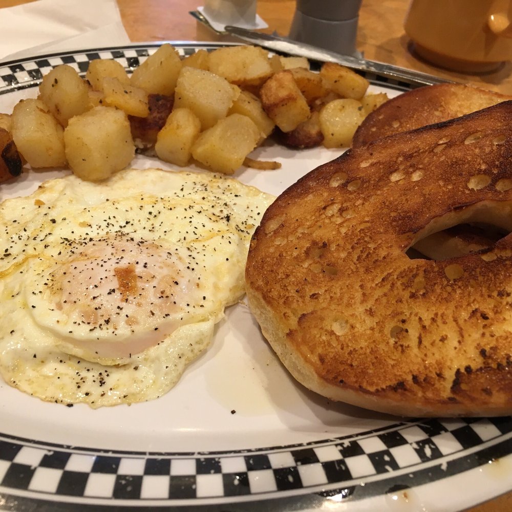 Mel's Commonwealth Cafe - 1 egg over easy with home fries and grilled bagel - Breakfast & Brunch Near Me - Wayland, Massachusetts Mel's Commonwealth Cafe - 1 egg over easy with home fries and grilled bagel - Breakfast & Brunch Near Me - Wayland, Massachusetts