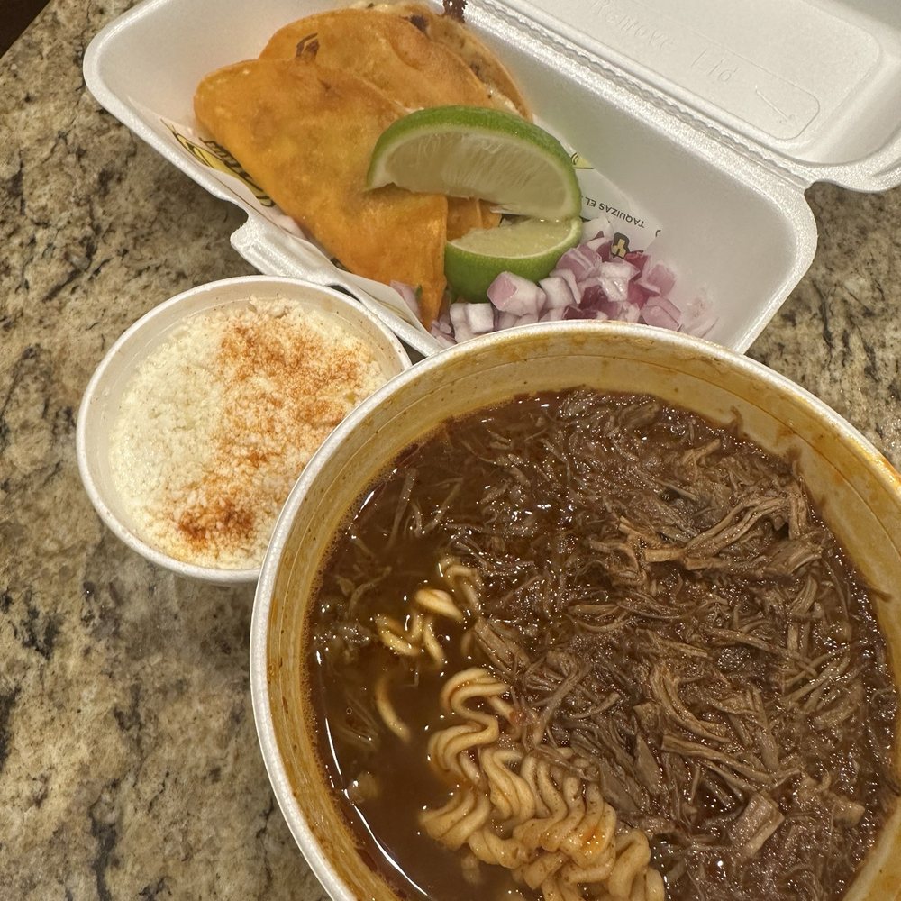 Two Birria Tacos with a side of Elote, and Ramen. Two Birria Tacos with a side of Elote, and Ramen.