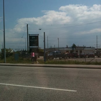 Burger World - a view of a parking lot from the side of the road - Burgers Near Me - North Bay, Ontario