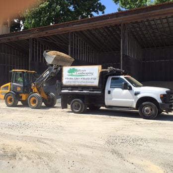 J. Reyes Landscaping - a dump truck and a backhoe - Landscaping Near Me - Methuen, Massachusetts J. Reyes Landscaping - a dump truck and a backhoe - Landscaping Near Me - Methuen, Massachusetts