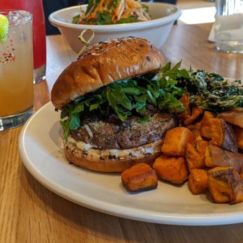 True Food Kitchen - Grass-fed burger with half kale half sweet potato hash Cocktail: La Paloma - New American Near Me - Columbus, Ohio