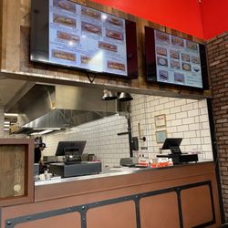 Chick-N-Run Hot Chicken & Wings - Register and menu board