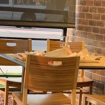 Buffalo Wild Wings - a table and chairs in front of a tv - Sports Bars Near Me - Hanford, California Buffalo Wild Wings - a table and chairs in front of a tv - Sports Bars Near Me - Hanford, California