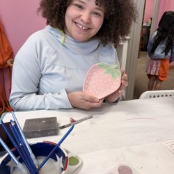 Paint A Pot - My Daughter painting her strawberry plate for her new kitten's food bowl but they gave it to someone else by accident