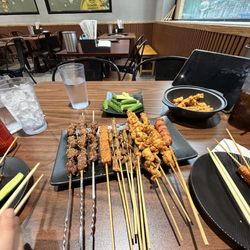 Fried chicken skin, taiwanese sausage, tiny beef skewers