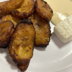 Sweet fried plantains with crema. Queso blanco