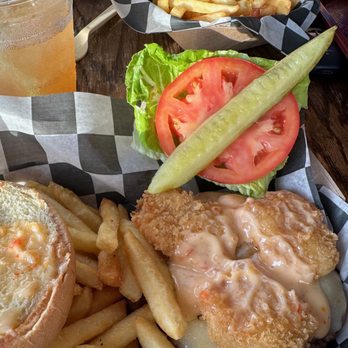 The Station Bar - SURF N' TURF BURGER Seasoned 8oz. burger, brioche bun, lettuce, pepperjack cheese, fried butterfly shrimp, special sauce $20 (Nov 2024) - Bars Near Me - Hampton Bays, New York