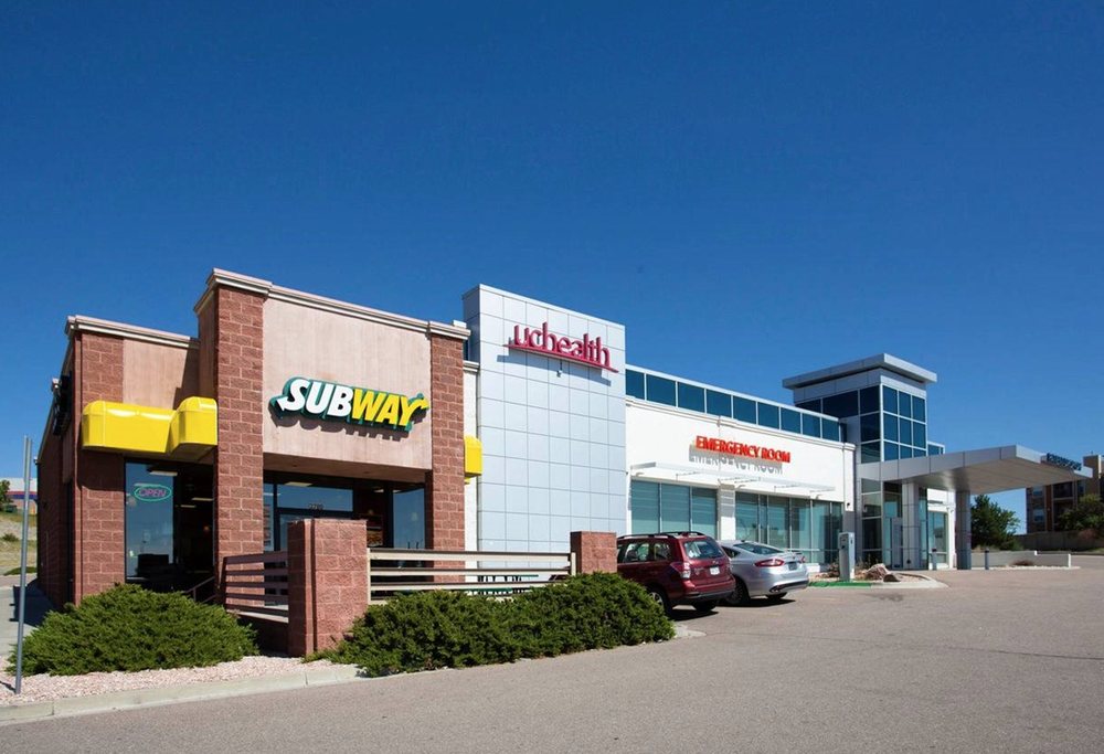 Woodmen Plaza Logo