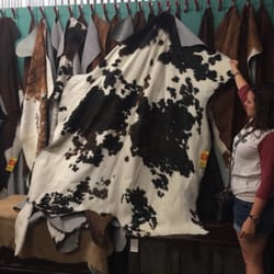 Texana Trading - Wall filled with gorgeous hides!