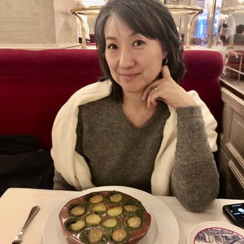 Benoit - My wife with her Escargot. perfectly done. - French Near Me - New York, New York