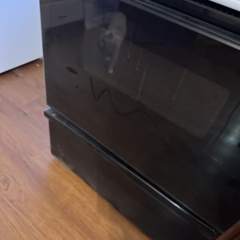 Upgrade Home Repair - Oven with white dust all over it. - Handyman Near Me