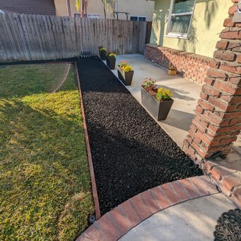 Damian Landscaping - After - they dug up all the weeds, added crushed rocks, weed barrier, and lava rocks! Will be difficult for weeds to push through! - Masonry/Concrete Near Me Damian Landscaping - After - they dug up all the weeds, added crushed rocks, weed barrier, and lava rocks! Will be difficult for weeds to push through! - Masonry/Concrete Near Me