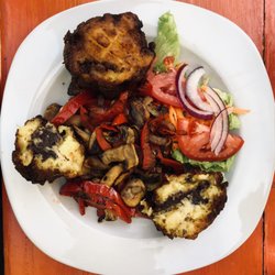 Jardin Tonantzin - Canoa (vegan): fried plantains stuffed with beans with mushrooms, paprika, soy sauce, and onions