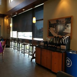 Starbucks - There are charging stations underneath the bar where those bar stools are.