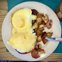a plate of food with eggs and potatoes a plate of food with eggs and potatoes