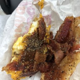 bacon and eggs on a piece of bread bacon and eggs on a piece of bread