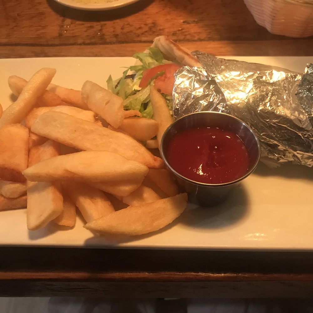 Lamb gyro with steak fries. Lamb gyro with steak fries.