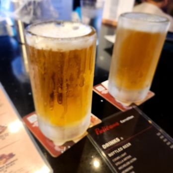 Pelicana Chicken - Models tap with frozen mug! - Chicken Wings Near Me - Carrollton, Texas