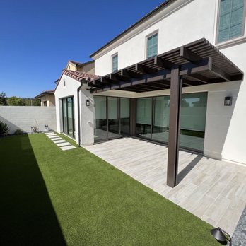 Zion Landscaping - Aluminum wood grain patio cover with porcelain tile - Landscaping Near Me Zion Landscaping - Aluminum wood grain patio cover with porcelain tile - Landscaping Near Me