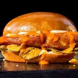 Seasoned and seared chicken raised without antibiotics, spicy Buffalo sauce, crispy pickle chips, and garlic aioli on a brioche roll. Seasoned and seared chicken raised without antibiotics, spicy Buffalo sauce, crispy pickle chips, and garlic aioli on a brioche roll.