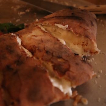 Lucali - Call one Pizza with cheese ozzying out omg I'm going to hell for eating this - Pizza Near Me - Brooklyn, New York