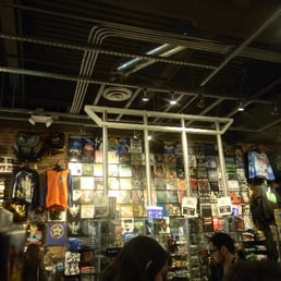 folded T shirts hanging from the rafters