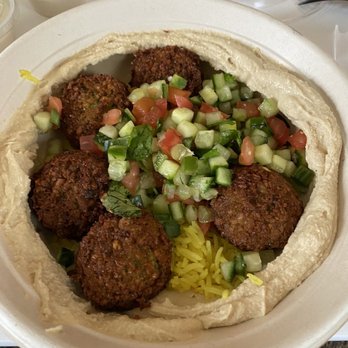 Naf Naf Grill - Hummus and falafel bowl with cucumbers, tomatoes, and rice. - Middle Eastern Near Me - Carmel, Indiana Naf Naf Grill - Hummus and falafel bowl with cucumbers, tomatoes, and rice. - Middle Eastern Near Me - Carmel, Indiana