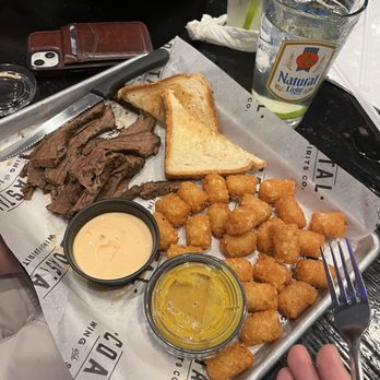 Coastal Wing & Spirits - Brisket (meat plate), tots, and Texas toast. It came with the golden sauce. My husband ended up choosing a different sauce (extra charge). - Chicken Wings Near Me - Surf City, North Carolina Coastal Wing & Spirits - Brisket (meat plate), tots, and Texas toast. It came with the golden sauce. My husband ended up choosing a different sauce (extra charge). - Chicken Wings Near Me - Surf City, North Carolina