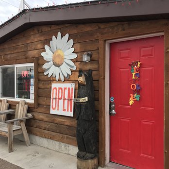 AMP Coffee - a red door and a sign that says open - Coffee & Tea Near Me - Great Falls, Montana