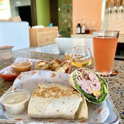 SoCal Vibes - Turkey wrap, pretzels w/ beer cheese, pomegranate beer, apple brandy ‍