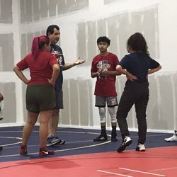 Coach Martinez talking to the wrestlers