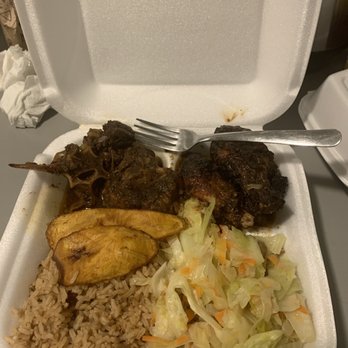 Mobay Cafe - Oxtails (half eaten top left corner), Jerk chicken (top right corn) Plantains Beans & rice Sautéed cabbage - Cafes Near Me - Milwaukee, Wisconsin Mobay Cafe - Oxtails (half eaten top left corner), Jerk chicken (top right corn) Plantains Beans & rice Sautéed cabbage - Cafes Near Me - Milwaukee, Wisconsin