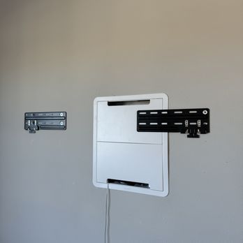Universal Mounting Services - Samsung frame TV wall brackets installed on the drywall. - TV Mounting Near Me Universal Mounting Services - Samsung frame TV wall brackets installed on the drywall. - TV Mounting Near Me