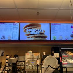 Dunkin' - It is the lady behind the cup lids. She was shorter than others and wore glasses.