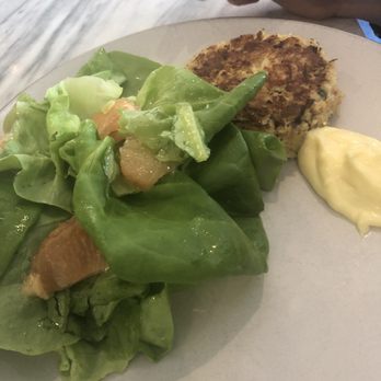 Henrietta Red - Crab cake with greens. Lots of crab. It was fine. - New American Near Me - Nashville, Tennessee