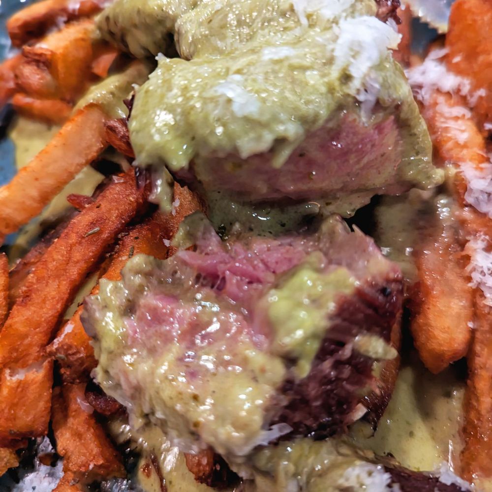 Salt Traders Zilker - Close up of cut up steak and frites - Seafood Near Me - Austin, Texas