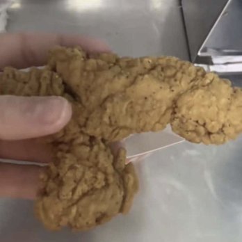 Whataburger - a hand holding a piece of fried chicken - Burgers Near Me - Mineola, Texas Whataburger - a hand holding a piece of fried chicken - Burgers Near Me - Mineola, Texas