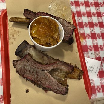 Black's Barbecue Austin - Gigantic beef rib. The picture does not do it justice. Also a little bit of peach cobbler. - Barbeque Near Me - Austin, Texas Black's Barbecue Austin - Gigantic beef rib. The picture does not do it justice. Also a little bit of peach cobbler. - Barbeque Near Me - Austin, Texas