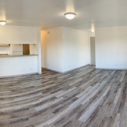 D's Home Repair Service - Living/Dining Room After - Repaint, new fixtures, new flooring & baseboard (painted to match cabinets)