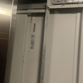 The Local Downtown - Broken elevator being opened by our saviors - Apartments Near Me - San Marcos, Texas The Local Downtown - Broken elevator being opened by our saviors - Apartments Near Me - San Marcos, Texas