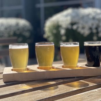 Black Swan Brewing - four glasses of beer on a wooden tray - Breweries Near Me - Stratford, Ontario Black Swan Brewing - four glasses of beer on a wooden tray - Breweries Near Me - Stratford, Ontario