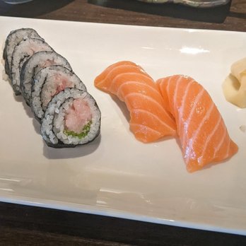 Sushiholic Arcadia - Yellow tail roll on the left and two pieces of salmon sushi on the right - Sushi Bars Near Me - Phoenix, Arizona Sushiholic Arcadia - Yellow tail roll on the left and two pieces of salmon sushi on the right - Sushi Bars Near Me - Phoenix, Arizona