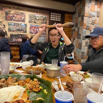 Isla Restaurant - Maneuvering w/ the giant wood spoon.. - Filipino Near Me - San Bruno, California Isla Restaurant - Maneuvering w/ the giant wood spoon.. - Filipino Near Me - San Bruno, California