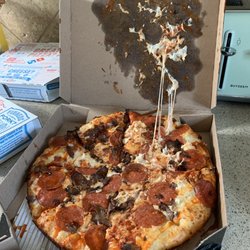 Domino's Pizza - This place just goes down hill. Pizza lately has been just thrown together, and now they are coming smashed in the box. Booooo dominos.