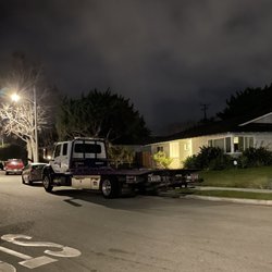 Smitty's Towing - Smithy's towing truck parked overnight on residential street