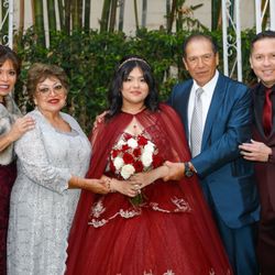 LA Celebrations Banquet Halls - Quinceañera with family after her religious ceremony at garden.
