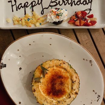 Tikis Grill & Bar - Maui Pineapple Creme Brûlée // free birthday dessert (cupcake with fruits) - Seafood Near Me - Honolulu, Hawaii Tikis Grill & Bar - Maui Pineapple Creme Brûlée // free birthday dessert (cupcake with fruits) - Seafood Near Me - Honolulu, Hawaii